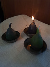 Load image into Gallery viewer, Three purple/green candles in holders on a textured surface with one candle lit.