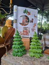 Load image into Gallery viewer, Beckah beeswax tree candles beside the NZ House &amp; Garden magazine page featuring them in 2025.
